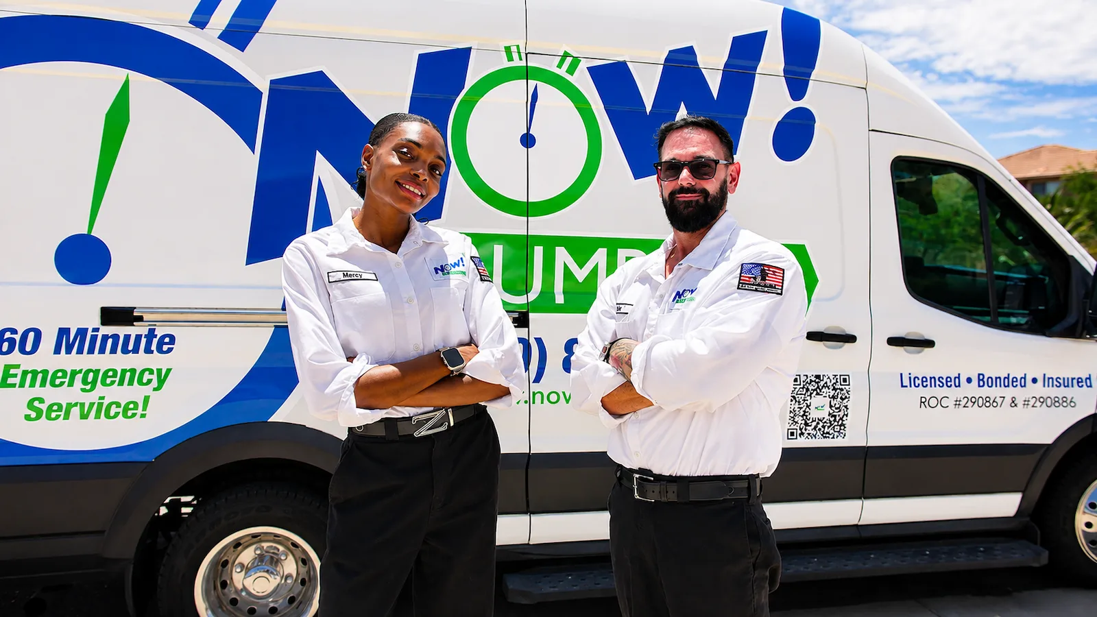 Mercy and Joe, owners of Now Plumbing, in front of a Now Plumbing van