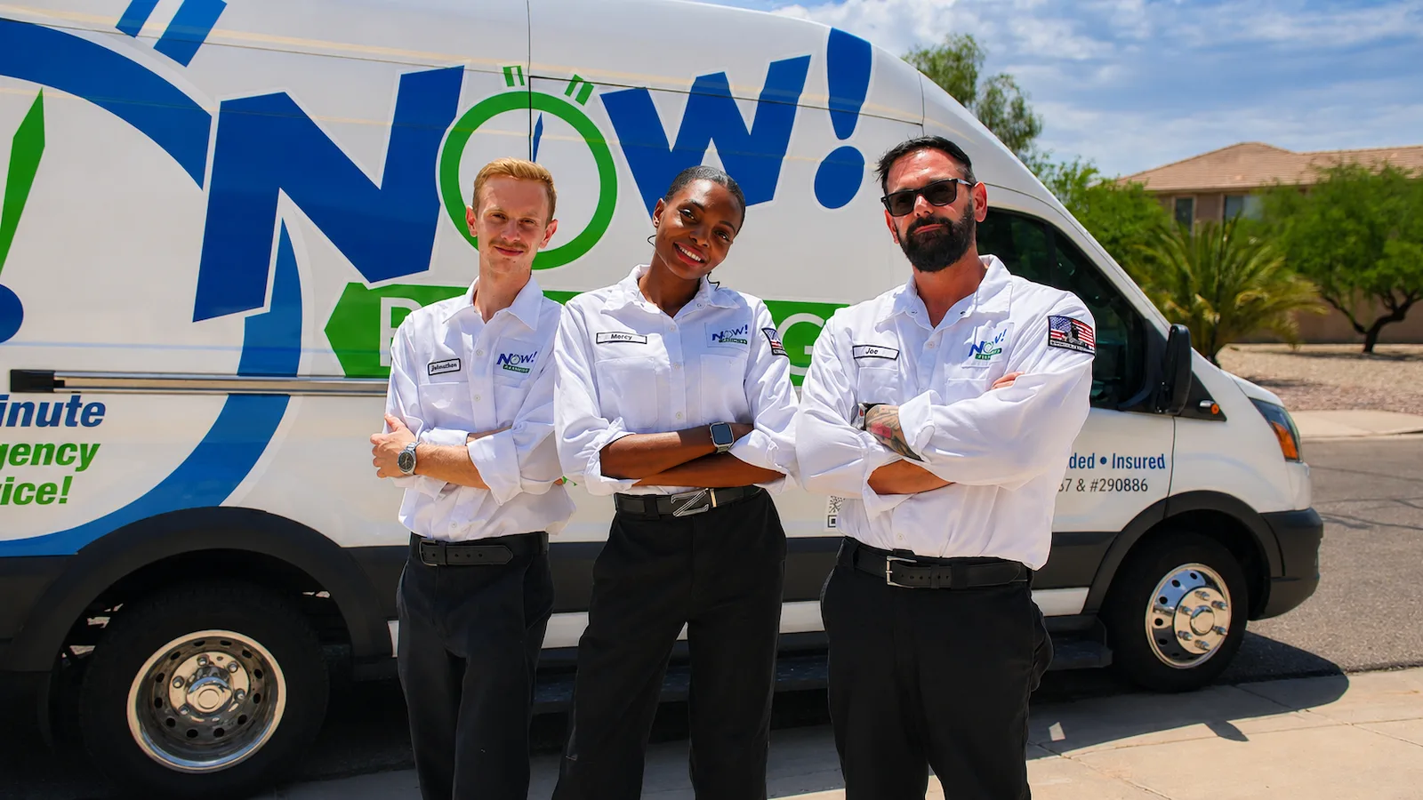 The Now Plumbing team with a Now Plumbing service van